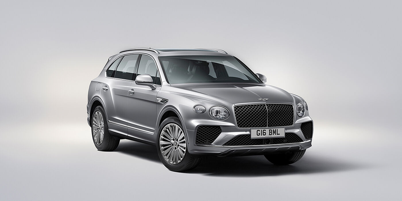 Bentley Lyon Bentley Bentayga luxury SUV front three quarter view in Moonbeam paint with matrix grille and 21″ 5 spoke painted wheels