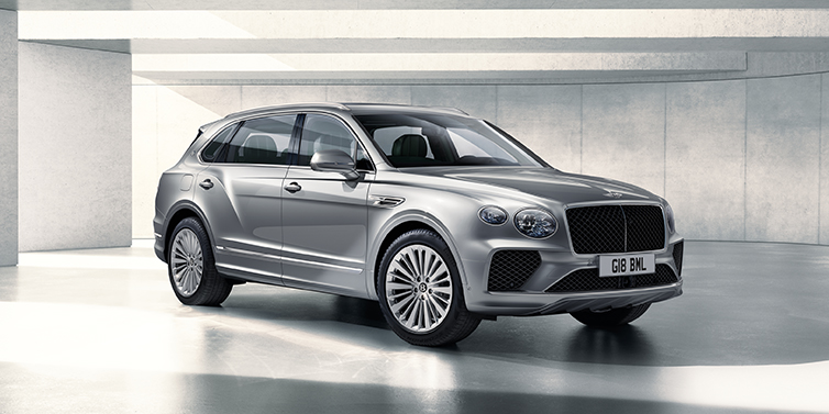 Bentley Lyon Bentley Bentayga Extended Wheelbase SUV front three quarter in Moonbeam paint with a grey background
